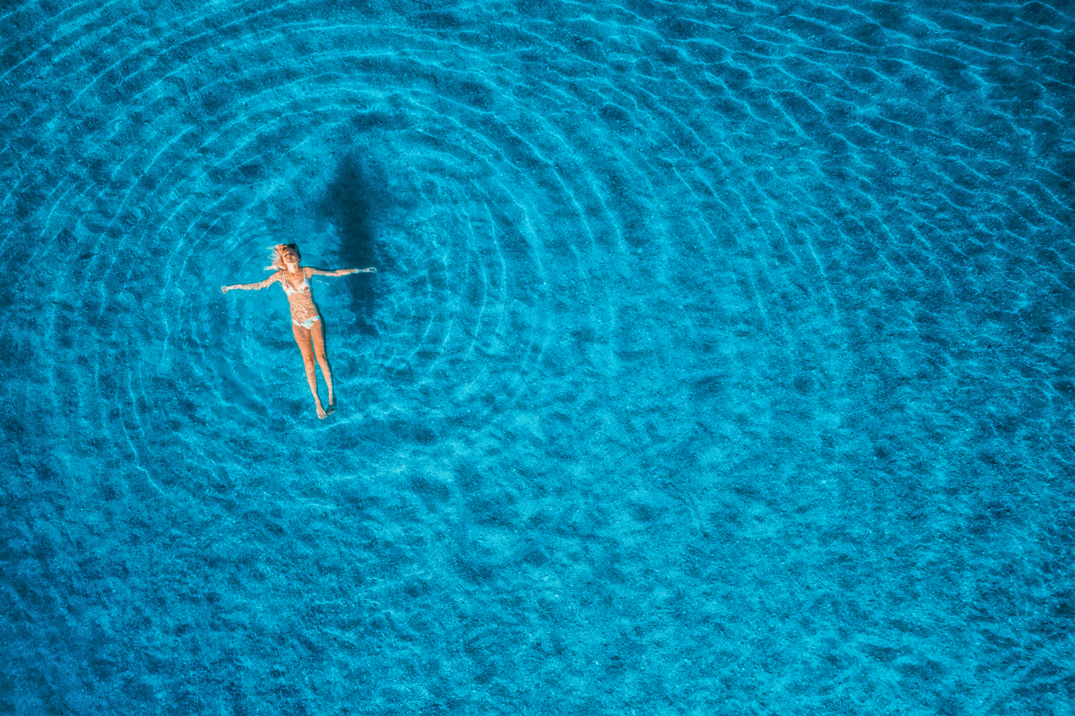 Aerial view of swimming woman in mediterranean sea